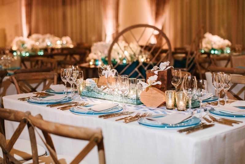 Succulent Centerpiece %26 Gold Flatware
Photography: Braedon Photography
Read More:
http://www.insideweddings.com/weddings/orthodox-jewish-wedding-with-outdoor-ceremony-inspired-by-the-sea/812/ ocean inspired wedding reception with wood bud vases, succulents, blue charger, gold flatware