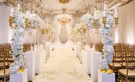 White and Gold Ceremony Decorations
Photography: Amy Anaiz Photography
Read More:
http://www.insideweddings.com/weddings/luxe-wedding-of-nfl-player-tahir-whitehead-at-elegant-castle-venue/1267/ ballroom wedding gold chairs white flower petal aisle white riser gold candelabra flower branches