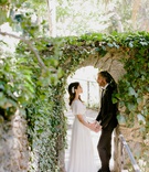 Couple at The Houdini Estate
Photography: Wild Whim Design + Photography
Read More:
http://www.insideweddings.com/weddings/outdoor-bohemian-fall-wedding-at-a-magical-venue-in-los-angeles/1238/ bride in boho dress with pretty headpiece holding hands with groom under stone arch greenery boho