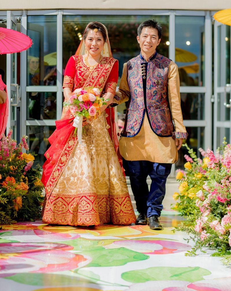 Bride with Father at Colorful Ceremony
Photography: Clane Gessel Photography
Read More:
http://www.insideweddings.com/weddings/colorful-city-view-wedding-featuring-indian-and-japanese-traditions/1353/ wedding ceremony vinyl floor aisle flower print japanese indian wedding ceremony processional