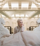 Wintry Long-Sleeve Wedding Dress
Photography: Collin Pierson Photography
Read More:
http://www.insideweddings.com/weddings/winter-wedding-inspirational-shoot-with-opulent-frosted-decor/1108/ Bride sitting down in long sleeve ball gown point d'esprit skirt embellished bodice long sleeves
