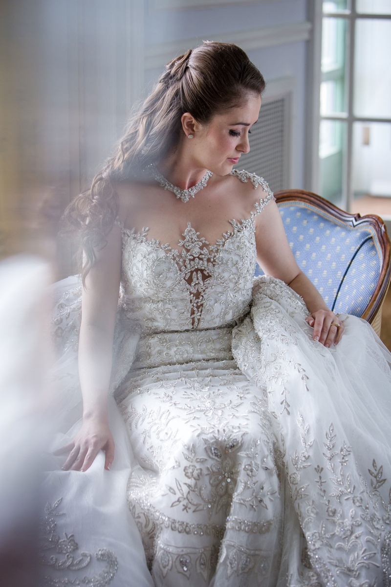 Beaded Ball Gown with Overskirt
Photography: Magnolia Studio
Read More:
http://www.insideweddings.com/weddings/charming-church-ceremony-romantic-ballroom-reception-in-quebec/1075/ Beaded ball gown with large overskirt illusion neckline jewels cap sleeves embellishments beading