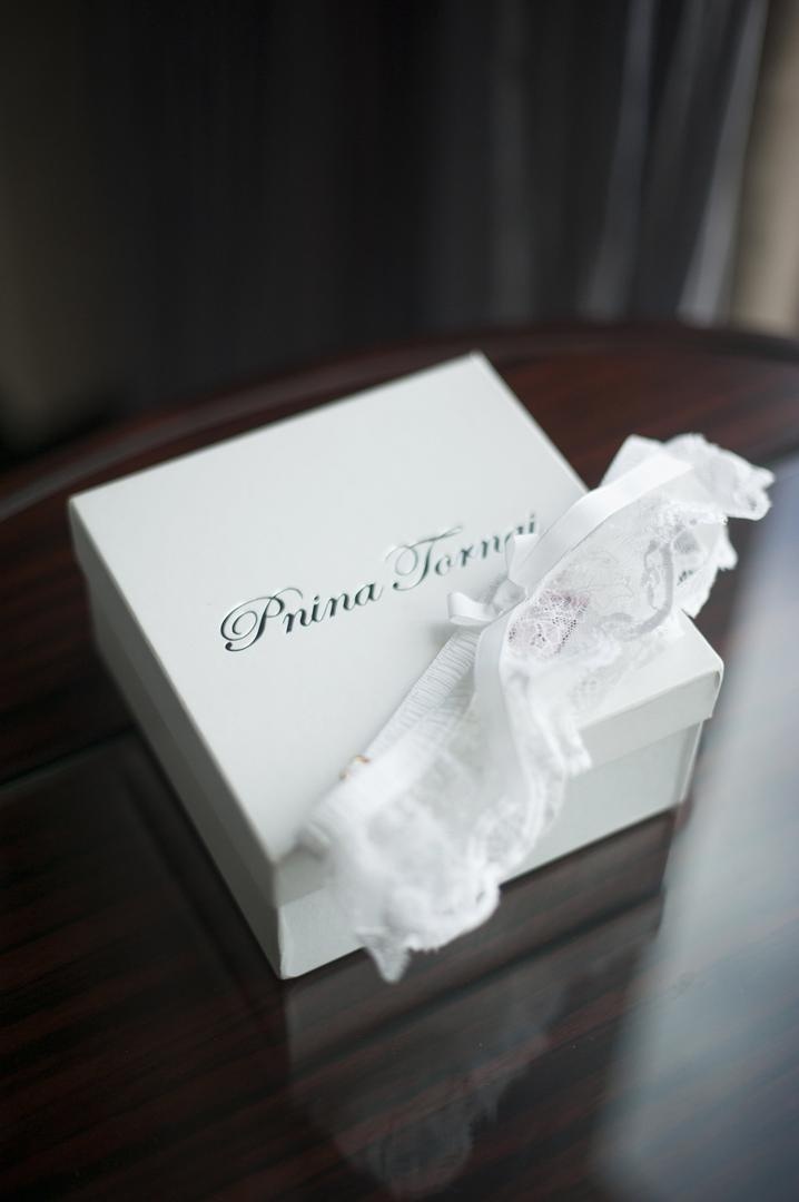 Wedding-Day Garter
Photography: Justin Marantz
Read More:
http://www.insideweddings.com/weddings/unforgettable-miami-wedding-with-acrobats-tiger-cubs-fireworks/437/ Pnina Tornai lace leg garter with white bow