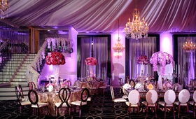 Vibrant Fairy-Tale Wedding Reception
Photography: Alakija Studios
Read More:
http://www.insideweddings.com/weddings/fairy-tale-wedding-with-vibrant-blush-fuchsia-gold-decor/1252/ wedding reception designed by lily v events bright purple lighting drapery chandelier metallic gold