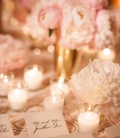 Calligraphy Escort Cards on Pattern Linens
Photography: Ira Lippke Studios
Read More:
http://www.insideweddings.com/weddings/opulent-destination-wedding-at-a-luxury-hotel-in-new-york-city/1004/ Texture linens with pink peony and white peony flowers candle votives gold vases escort card table