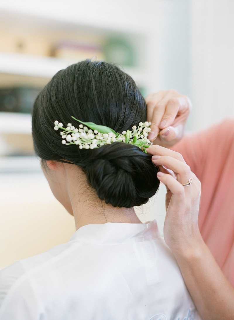 Natural Lily of the Valley Headpiece
Photography: Michelle Beller Photography
Read More:
http://www.insideweddings.com/weddings/classic-ceremony-beachfront-ballroom-reception-in-santa-monica/1234/ bride with low chignon hairstyle low bun wedding day with small lily of the valley blooms headpiece
