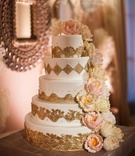 Gold Filigree Cake
Photography: Samuel Lippke Studios
Read More:
http://www.insideweddings.com/weddings/dreamy-newport-beach-california-wedding-with-breathtaking-decor/425/ White cake with gold details and sugar flower peonies