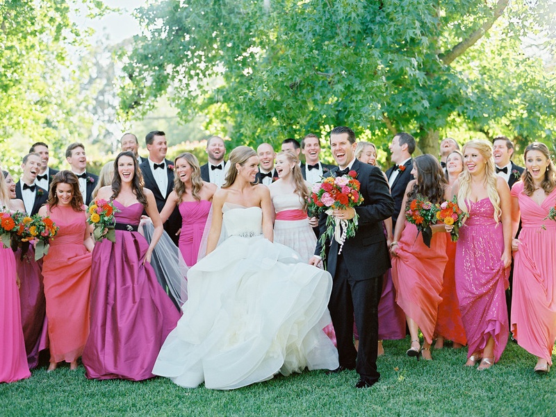 12 Pink %26 Orange Bridesmaids and 12 Groomsmen
Photography: Ryan Ray Photography
Read More:
http://www.insideweddings.com/weddings/outdoor-wedding-with-vibrant-pink-orange-decor-in-california/723/ Bride in Vera Wang wedding dress with groom in tuxedo and bridesmaids in pink and orange dresses