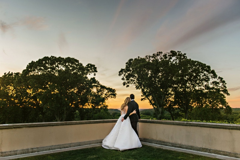 Bride %26 Groom Staring Into Sunset
Photography: Dear Stacey
Read More:
http://www.insideweddings.com/weddings/sentimental-alfresco-ceremony-classic-reception-at-oheka-castle/1016/ Wedding photo bride and groom looking at Sunset from balcony at Oheka Castle Angel Sanchez tuxedo