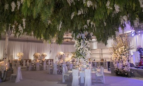Greenery Ceiling Installation Overhead
Photography: Curtis Dahl Photography
Read More:
http://www.insideweddings.com/weddings/spring-outdoor-ceremony-ballroom-reception-with-cultural-elements/1313/ wedding reception ballroom violet lighting greenery overhead white flowers silver decor bar band