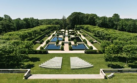 White Chairs Set Up at Oheka Castle
Photography: Dear Stacey
Read More:
http://www.insideweddings.com/weddings/sentimental-alfresco-ceremony-classic-reception-at-oheka-castle/1016/ Wedding ceremony venues in New York castle Oheka Castle wedding ideas