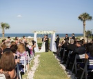 Wedding Party Applauds First Kiss
