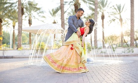 Groom Dips Bride in Front of Fountain
Photography: Fully Alive Photography
Read More:
http://www.insideweddings.com/weddings/cultural-inspirational-wedding-with-vibrant-colors-in-arizona/1147/ south asian wedding inspiration, bride in lehenga, groom dips bride in front of fountain