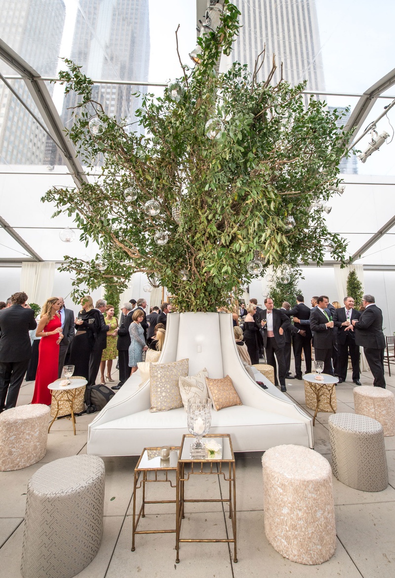 White Lounge Furniture Around Tree
Photography: Carasco Photography
Read More:
http://www.insideweddings.com/weddings/traditional-ceremony-glamorous-garden-inspired-tented-reception/943/ Indoor tree tent wedding cocktail hour reception tree like arrangement neutral pillows ottomans