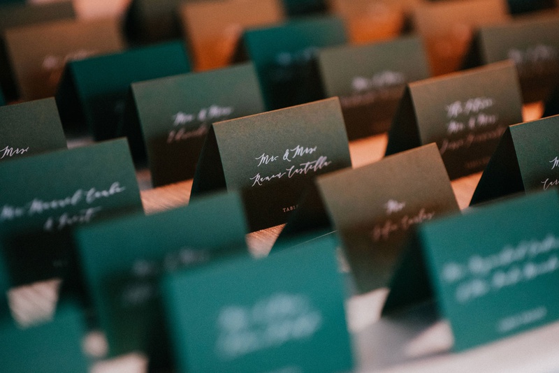 Emerald Green Escort Cards
Photography: Jonathan Connolly Photography
Read More:
http://www.insideweddings.com/weddings/elegant-modern-wedding-with-emerald-color-palette-in-miami/1307/ emerald green escort cards with white calligraphy script on table with white linen