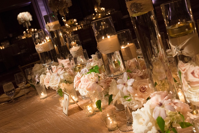 Reception Table with Low Arrangements %26 Candles
Photography: Boyd Harris Photographs
Read More:
http://www.insideweddings.com/weddings/a-jeweled-floral-wedding-at-fairmont-grand-del-mar-in-san-diego/745/ Reception table with floating candle and orchid rose flower arrangements