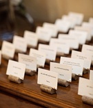 Wine Cork Place Card Holders
Photography: Kristen Weaver Photography
Read More:
http://www.insideweddings.com/weddings/a-tuscan-themed-jewish-wedding-in-florida-with-natural-details/654/ Wedding place card table with faux wine cork place card holders