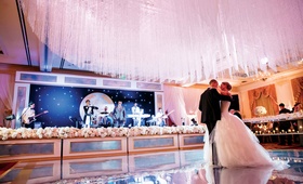 Crystal Ceiling Treatment Over Dance Floor
Photography: Karlisch Studio
Read More:
http://www.insideweddings.com/weddings/classic-ceremony-at-smu-chapel-ballroom-reception-in-dallas/731/ Bride and groom first dance on dance floor with crystal ceiling treatment and pink lighting