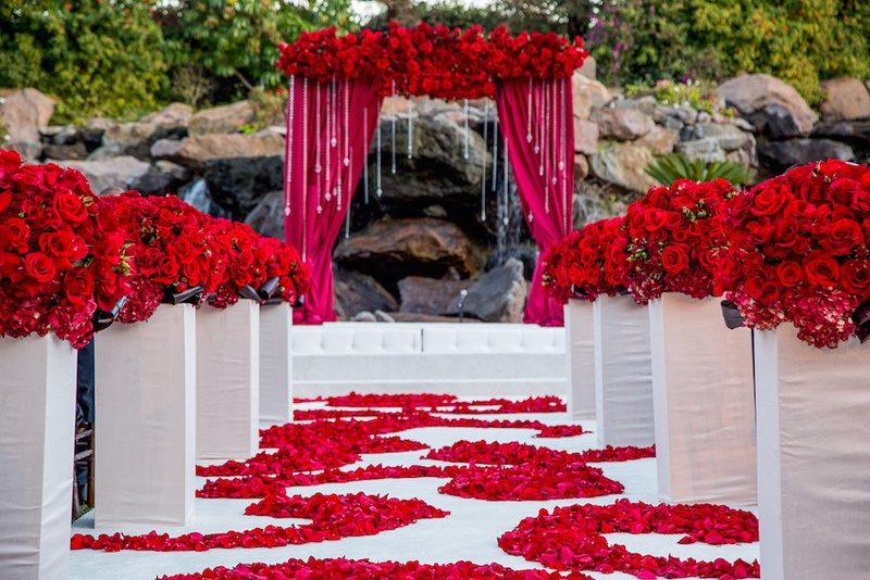 Red and White Ceremony Décor
Photography: Yogi Patel - Global Photography
Read More:
http://www.insideweddings.com/weddings/indian-wedding-with-vibrant-colors-and-gorgeous-red-roses/639/ Outdoor wedding with lake and rocks in background