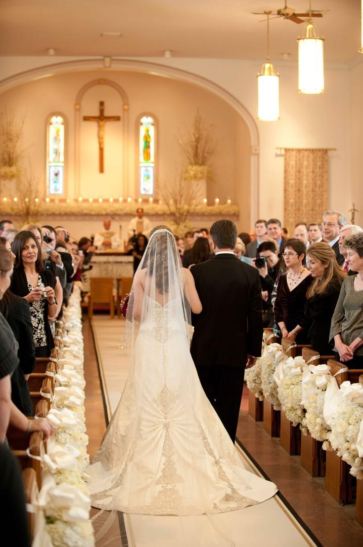 Bride Being Escorted to Altar
Photography: Josh Lynn Photography
Read More:
http://www.insideweddings.com/weddings/purple-white-gold-new-jersey-celebration/339/ Bride in a veil and strapless dress with beading and lace details walking down the aisle with father