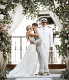 First Kiss at Boho-Chic Ceremony
Photography: Belle Ombre Photography
Read More:
http://www.insideweddings.com/weddings/vintage-bohemian-inspired-wedding-on-historic-bridge-in-cleveland/1373/ wedding ceremony vintage rug aisle runner greenery pink lavender flowers boat captain officiant