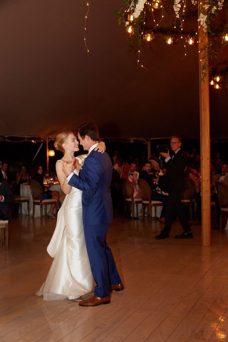 First Dance at Hamptons Tent Wedding
Photography: Christian Oth Studio
Read More:
http://www.insideweddings.com/weddings/timeless-wedding-with-garden-inspired-decor-in-the-hamptons/1237/ bride in classic wedding dress groom in blue suit dancing on wood floor to first dance song