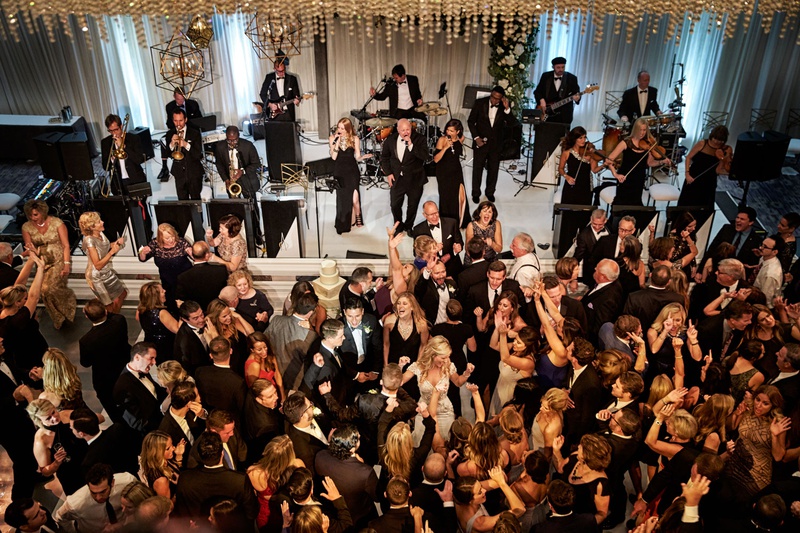Guests %26 Family Dancing in Chicago
Photography: KingenSmith
Read More:
http://www.insideweddings.com/weddings/modern-romantic-wedding-with-glam-geometric-details-in-chicago/1171/ Wedding reception live band bride groom guests dancing on dance floor modern wedding entertainment