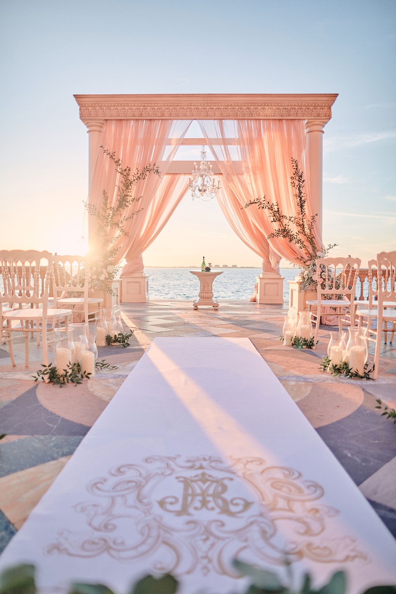 Ornate Aisle Runner
Photography: Binaryflips Photography
Read More:
http://www.insideweddings.com/weddings/bayfront-ceremony-garden-courtyard-reception-in-sarasota-florida/1344/ ornate monogram on aisle runner for wedding ceremony overlooking sarasota bay