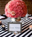Table Name and Centerpiece
Photography: dMdC Photography
Read More:
http://www.insideweddings.com/weddings/black-white-pink-fashion-themed-bridal-shower/490/ Framed table name and pink centerpiece