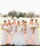 Bridesmaids in Off-Shoulder Blush Gowns
Photography: Jennefer Wilson Photography
Read More:
http://www.insideweddings.com/weddings/gorgeous-dallas-wedding-with-outdoor-ceremony-ballroom-reception/998/ Bride in trumpet gown with large white bouquet and bridesmaids in light pink off shoulder long dress