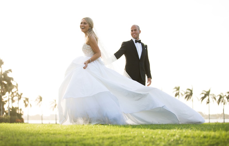 Bride in Voluminous Ball Gown with Groom
Photography: Nancy Cohn Photography
Read More:
http://www.insideweddings.com/weddings/destination-wedding-with-white-gold-color-palette-in-palm-beach/1028/ Bride in strapless ball gown with long train with groom in tuxedo Palm Beach Florida