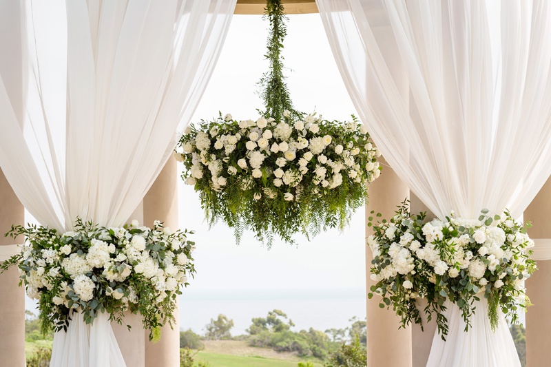 Floral Chandelier at Ceremony
Photography: Chard Photo
Read More:
http://www.insideweddings.com/weddings/alfresco-ceremony-on-the-coast-classic-ballroom-reception/1290/ the resort at pelican hill wedding under a rotunda with floral chandelier