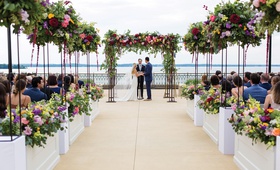Colorful Ceremony Space Overlooking Lake
Photography: Kent Drake Photography
Read More:
http://www.insideweddings.com/weddings/bright-and-colorful-wedding-palette-with-ceremony-overlooking-lake/1315/ colorful flowers lining a wedding ceremony overlooking lake mendota
