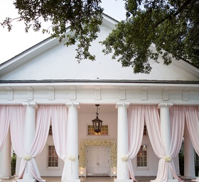 Pink %26 Ivory Ceremony on Porch
Photography: Sarah Kate, Photographer
Read More:
http://www.insideweddings.com/weddings/outdoor-fall-ceremony-opulent-tented-reception-in-dallas-texas/1022/ Wedding ceremony on porch with wood aisle runner pink drapery between columns white flowers chairs