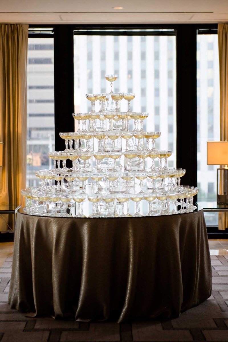 Champagne Tower on Large Round Table
Photography: Studio This Is
Read More:
http://www.insideweddings.com/weddings/glamorous-city-style-real-wedding-at-a-luxury-hotel-in-chicago/1217/ wedding reception city view chicago large mirror table coupe glass champagne tower