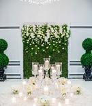 Table with Candles in Front of Hedge Wall
Photography: Lilly Photography
Read More:
http://www.insideweddings.com/weddings/traditional-greek-orthodox-ceremony-ballroom-reception-in-chicago/1105/ Wedding reception textured linen on round table flower arrangements candle votives hedge boxwoo