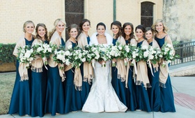 Bridesmaids in Blue with Pashminas
Photography: Heather Rowland Photography %26 Thisbe Grace Photography
Read More:
http://www.insideweddings.com/weddings/gorgeous-blue-white-gold-wedding-with-lush-greenery-in-texas/1107/ Bride in Romona Keveza wedding dress with fur wrap and bridesmaids in navy blue with champagne throw