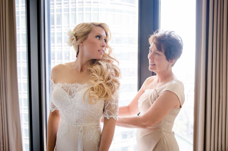 One-Shoulder Mother-of-Bride Gown
Photography: Studio This Is
Read More:
http://www.insideweddings.com/weddings/glamorous-city-style-real-wedding-at-a-luxury-hotel-in-chicago/1217/ bride in off shoulder illusion wedding dress long blonde hair curls flower headpiece mother