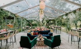 Tented Lounge with Boho-Chic Décor
Photography: Joseph West Photography
Read More:
http://www.insideweddings.com/weddings/childhood-friends-say-i-do-at-garden-inspired-wedding-in-austin/1338/ wedding reception clear tent rattan pendant chandelier velvet lounge furniture bar stools lights