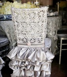 Ruffled Silver Chair Cover
Photography: Kevin Beasley Photographer
Read More:
http://www.insideweddings.com/weddings/opulent-wedding-with-gatsby-inspired-theme-at-louisiana-plantation/747/ Silver ruffle chair skirt at opulent wedding reception with lacelike cover