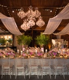 Chandeliers Grouped Together
Photography: Ira Lippke Studios
Read More:
http://www.insideweddings.com/weddings/a-lakeside-black-tie-wedding-with-a-summer-camp-theme/938/ group of chandeliers in middle of ceiling above wedding reception