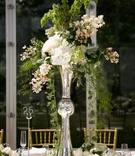 Metallic Wedding Centerpiece
Photography: lauren b. photography
Read More:
http://www.insideweddings.com/weddings/traditional-catholic-ceremony-romantic-tented-at-home-reception/664/ Trumpet vase centerpiece with green vines and white flowers
