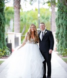 Groom with Bride Holding Skirt
Photography: Victoria Angela Photography
Read More:
http://www.insideweddings.com/weddings/church-ceremony-modern-elegant-reception-in-orlando-florida/1099/ bride in hayley paige ball gown with tulle skirt with nude-lined bodice, groom in suit