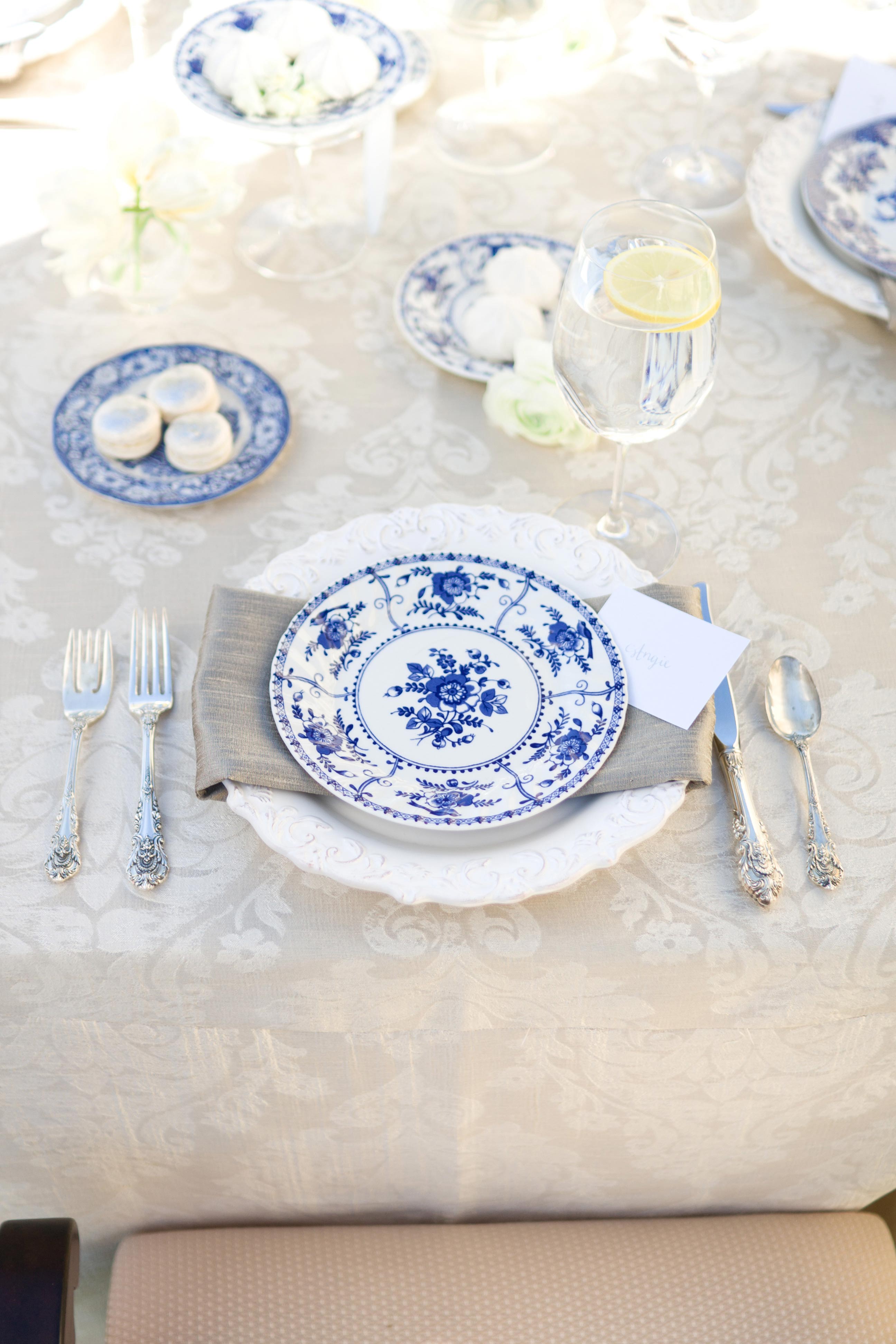 blue and white china on table at outdoor bridal shower